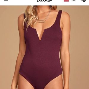 Never worn, burgundy sleeveless bodysuit with V-neck